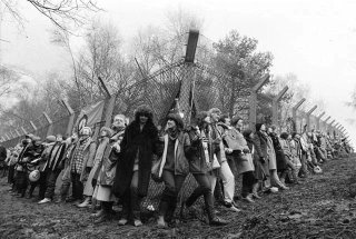 Greenham Common Women in 1982 - CND logo on the missile-base fence