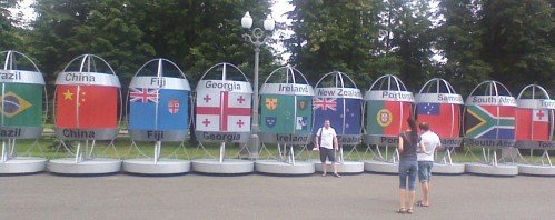 Sputniks on wheels, with flags